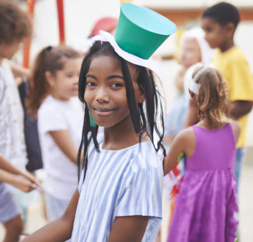 girl wearing a party hat at a school carnival fundraiser
